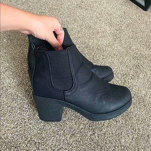 Womens black leather chunky heel booties.